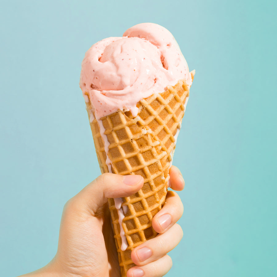 Hand holding an ice cream cone